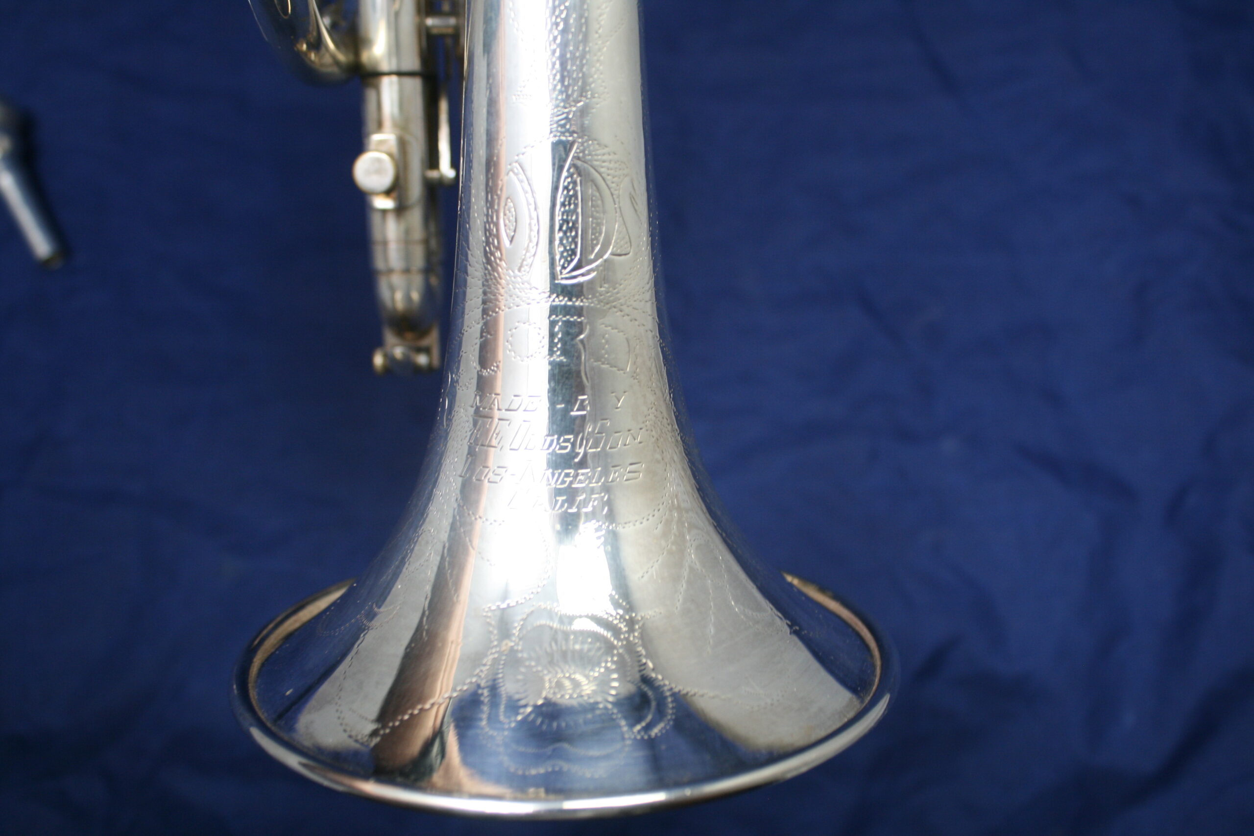 The bell is plated or made of the same as the rest of the instrument (Silver or Gold)