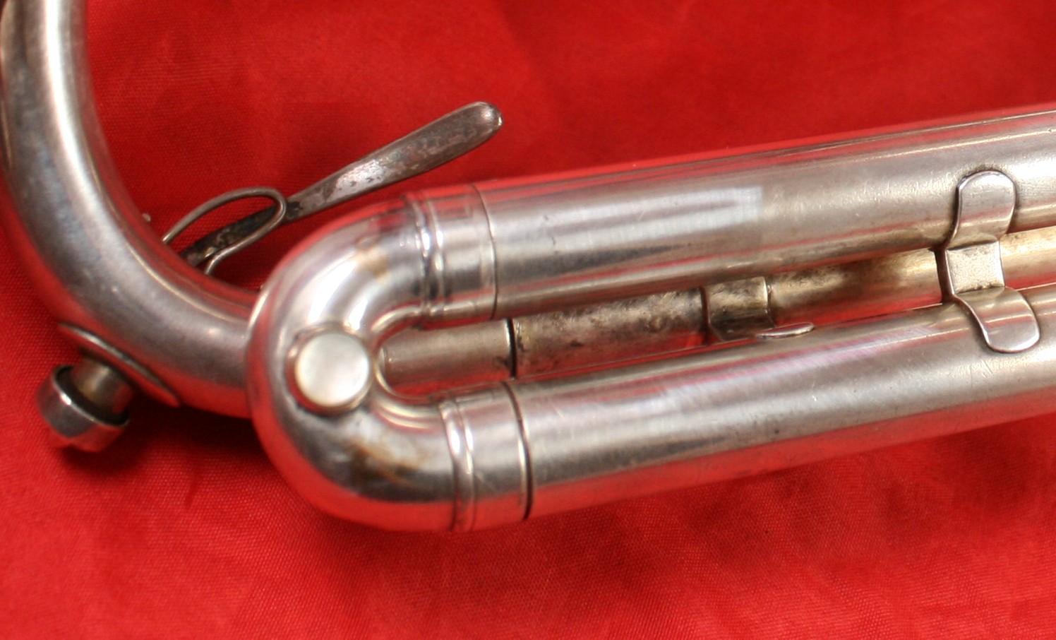 There is not a water key on the 3rd valve slide (very early models and some cornets)